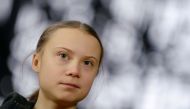 FILE PHOTO: Swedish climate activist Greta Thunberg talks to the media before meeting with EU environment ministers in Brussels, Belgium, March 5, 2020. REUTERS/Johanna Geron/File Photo
 