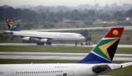 FILE PHOTO: A South African Airways (SAA) plane is towed at O.R. Tambo International Airport in Johannesburg, South Africa, January 18, 2020. Picture taken January 18, 2020. REUTERS/Rogan Ward