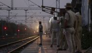 Railway Protection Force personnel stand at a platform as a special train carrying migrant labourers from Nasik arrives during a government-imposed nationwide lockdown as a preventive measure against the COVID-19 coronavirus, at Misrod railway station in 