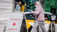 A medical staff walks near a testing point for the COVID-19 coronavirus in central Moscow on May 2, 2020. Russia on Saturday reported its largest increase in coronavirus cases with the new infections rising by nearly 10,000 in a single day. / AFP / Yuri K