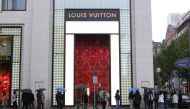 People wait in line to get into a Louis Vuitton store on May 2, 2020, in Frankfurt am Main, western Germany, amid the coronavirus COVID-19 pandemic. / AFP / Yann Schreiber