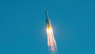 :(FILES) This file photo taken on May 5, 2020 shows a Long March 5B rocket lifting off from the Wenchang launch site on China's southern Hainan island. China's new prototype spacecraft 