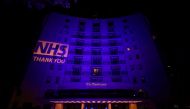 The Dorchester Hotel lit up in blue in support of the NHS, following the outbreak of the coronavirus disease (COVID-19), London, Britain, May 11, 2020. REUTERS/Hannah Mckay
