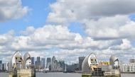 The office buildings in the financial area of Canary Wharf in London are seen behind the Thames Barrier on May 14, 2020. Britain's economy shrank in the first quarter at the fastest pace since the 2008 financial crisis as the country went into lockdown ov