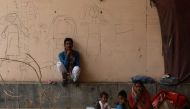Migrants are sit outside a shelter home, during an extended nationwide lockdown to slow the spread of the coronavirus disease (COVID-19), in New Delhi, India, May 14, 2020. Reuters/Anushree Fadnavis