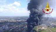 Large clouds of black smoke billow from a chemical plant after an explosion, in Marghera, near Venice, Italy, May 15, 2020. Vigili del Fuoco/Handout via REUTERS
