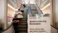 A poster reminding shoppers to maintain social distance to prevent the spread of the coronavirus disease (COVID-19) is placed beside an escalator in a shopping mall in Quezon City, Metro Manila, Philippines, May 17, 2020. REUTERS/Eloisa Lopez
