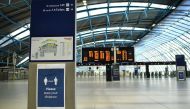 :A sign on the concourse advises passengers to adhere to social distancing at Waterloo Train station in central London on May 18, 2020. AFP / Ben STANSALL
