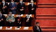 Chinese President Xi Jinping greets officials wearing face masks following the coronavirus disease (COVID-19) outbreak as he arrives for the opening session of the Chinese People's Political Consultative Conference (CPPCC) at the Great Hall of the People 