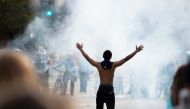 Police fire tear gas at protestors on Wednesday, May 27, 2020, during the second day of protests over the death of George Floyd in Minneapolis.  Steel Brooks - Anadolu 