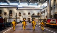 Servicemen of Russia's Emergencies Ministry wearing protective gears disinfect Moscow's Kazansky railway station on May 28, 2020, as the country adopts measures to curb the spread of the COVID-19 (the novel cornovairus). / AFP / Dimitar DILKOFF
