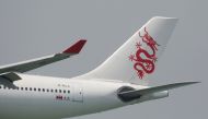 FILE PHOTO: A Cathay Dragon Airbus A330-300 plane descends before landing at Hong Kong Airport in Hong Kong, China April 4, 2018. REUTERS/Bobby Yip