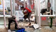 Protesters loot a store after marching against the death in Minneapolis police custody of George Floyd, in the Manhattan borough of New York City, U.S., June 1, 2020. REUTERS/Eduardo Munoz
