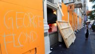 A message is seen painted on the exterior of the Louis Vuitton store after it was damaged by protesters after they participated in a march against the death in Minneapolis police custody of George Floyd, in the Manhattan borough of New York City, U.S., Ju