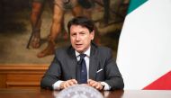 This photo taken on June 11, 2020 and handout on June 12, 2020 by the Palazzo Chigi press office, Italy's Prime Minister Giuseppe Conte addresses a press conference following a Cabinet meeting at Palazzo Chigi in Rome, during the COVID-19 infection, cause