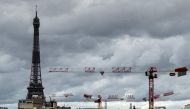 A picture taken on June 12, 2020, shows the Eiffel tower and cranes in Paris. / AFP / JOEL SAGET