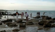 People are seen at a beach after the government eased some protective measures following the coronavirus disease (COVID-19) outbreak, in Hua Hin, Thailand June 13, 2020. REUTERS/Jorge Silva
