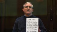 Paul Whelan, a former US marine accused of espionage and arrested in Russia in December 2018, stands inside a defendants' cage as he waits to hear his verdict in Moscow on June 15, 2020. AFP / Kirill Kudryavtsev 