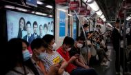 People wearing face masks are seen in a subway car in Shanghai, following the coronavirus disease (COVID-19) outbreak, China June 16, 2020. REUTERS/Aly Song
