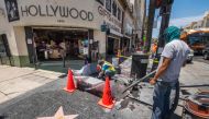 Workers clean up a 