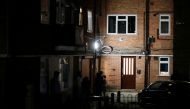 Residents outside a block of flats where suspect was earlier apprehended following reported multiple stabbings in Reading, Britain, June 20, 2020. REUTERS/Peter Cziborra