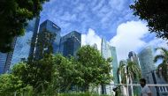 People exercise along the promenade at Marina Bay in Singapore on June 19, 2020, as restrictions to prevent the spread of the COVID-19 novel coronavirus are eased. AFP / Roslan Rahman 