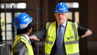 Britain's Prime Minister Boris Johnson talks with year-ten pupil Vedant Jitesh as he visits the construction site of Ealing Fields High School, in west London, Britain, June 29, 2020. REUTERS/Toby Melville/Pool