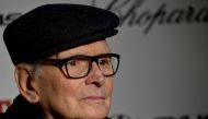In this file photo taken on January 28, 2016, Italian composer Ennio Morricone poses as he arrives for the premiere of the film 'The Hateful Eight' in Rome. Ennio Morricone, one of the world's best-known and most prolific film composers, has died in Rome,