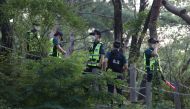 South Korean policemen conduct a search operation for Seoul Mayor Park Won-soon in Seoul, South Korea, July 9, 2020. Yonhap via REUTERS