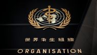 (FILES) This file photo taken on February 24, 2020 shows the logo of the World Health Organization (WHO) written in French and Chinese at the entrance of their headquarters in Geneva. / AFP / Fabrice COFFRINI
