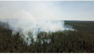 An aerial view shows smoke rising from a forest fire burning in Krasnoyarsk region, Russia, in this still image taken from undated handout video obtained by Reuters July 10, 2020. The Aerial Forest Protection Service/Handout via REUTERS 