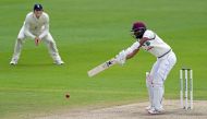 West Indies' Kraigg Brathwaite plays a shot on the fourth day of the second Test cricket match between England and the West Indies at Old Trafford in Manchester, northwest England on July 19, 2020. / AFP / POOL / Jon Super