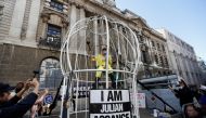 Vivienne Westwood uses a bullhorn as she demonstrates outside the Old Bailey in support of Julian Assange, in London, Britain, July 21, 2020. REUTERS/Peter Nicholls