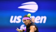 In this file photo Rafael Nadal of Spain hits a return to Daniil Medvedev of Russia during the men's Singles Finals match at the 2019 US Open at the USTA Billie Jean King National Tennis Center in New York on September 8, 2019. US Open organisers said Jul