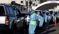 FILE PHOTO: Medical personnel administer tests for the coronavirus disease (COVID-19) at the Bondi Beach drive-through testing centre, as the state of New South Wales grapples with an outbreak of new cases, in Sydney, Australia, July 20, 2020. REUTERS/Lor