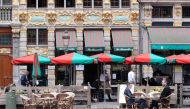 People sit on a terrace as restaurants and bars reopen after weeks of lockdown restrictions amid the coronavirus disease (COVID-19) outbreak, in Brussels, Belgium, June 8, 2020. REUTERS/Yves Herman/File Photo