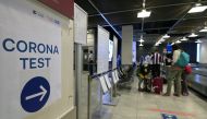A sign 'corona test' is seen at a corona screening station in the medical center of the airport in Duesseldorf, western Germany, on July 27, 2020, amid the new coronavirus COVID-19 pandemic. / AFP / Ina FASSBENDER
