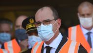 French Prime Minister Jean Castex (C), wearing a protective face mask, visits the combined transport site in Bonneuil-sur-Marne, southeastern suburbs of Paris on July 27, 2020. / AFP / CHRISTOPHE ARCHAMBAULT