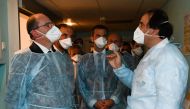 French Prime Minister Jean Castex (L) speaks a doctor during a visit at CHU hospital in Montpellier, southern France, on August 11, 2020. / AFP / POOL / Pascal GUYOT
