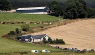 Emergency responders gather at the scene of a derailed passenger train near Stonehaven in Scotland, Britain, August 12, 2020. REUTERS/Russell Cheyne