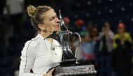 February 22, 2020 Romania's Simona Halep poses with a trophy as she celebrates after winning the final against Kazakhstan's Elena Rybakina REUTERS/Satish Kumar Subramani/File Photo