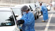 Healthcare workers register people at a coronavirus disease (COVID-19) drive in test centre at Rome's San Giovanni hospital in Rome, Italy, August 18, 2020. REUTERS/Remo Casilli
