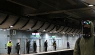 Commuters practice social distancing at a train station, as the state of New South Wales continues to report low numbers for new daily cases of the coronavirus disease (COVID-19), in Sydney, Australia, August 19, 2020. REUTERS/Loren Elliott