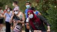 People queue to make PCR test outside at Federica Montseny primary health care center during the coronavirus disease (COVID-19) pandemic in Madrid, Spain, August 20, 2020. REUTERS/Juan Medina
