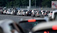 Vehicles, some from Austria, Slovenia and Germany, queue at the Macelj border crossing between Croatia and Slovenia, as many tourists take heed of a recommendation from their home country and leaving Croatia as the number of coronavirus infections rose to