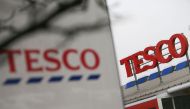 In this file photo taken on January 27, 2017 signage for a branch of a Tesco in London is pictured. Supermarket giant Tesco said Monday, August 24, it will create 16,000 permanent UK jobs to meet soaring online demand for groceries triggered by the corona