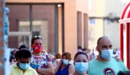 People queue to undergo a PCR test at Coronel Palma primary health care center during the coronavirus disease (COVID-19) pandemic in Mostoles, Spain, August 22, 2020. REUTERS/Sergio Perez
