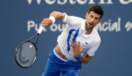 AUGUST 29: Novak Djokovic of Serbia serves to Milos Raonic of Canada in the men's singles final of the Western & Southern Open at the USTA Billie Jean King National Tennis Center on August 29, 2020 in the Queens borough of New York City. Matthew Stockman/