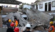 Rescue workers are seen at the site where a restaurant collapsed, in Xiangfen, Shanxi province, China August 29, 2020. Picture taken August 29, 2020. cnsphoto via REUTERS
