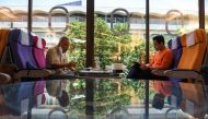 Customers eat at Thai Airways pop-up airplane-themed restaurant at the airlines headquarters with onboard meals prepared by their chefs, while their fleet is still grounded at the airport and the company awaits a bankruptcy court decision, in Bangkok, Tha